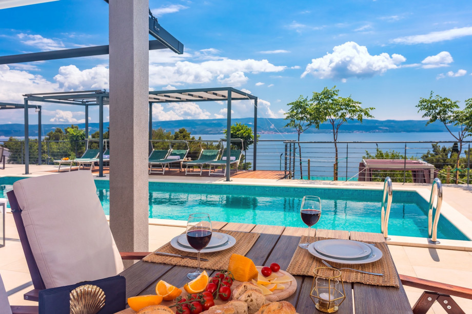 Dining area with barbecue and open sea views