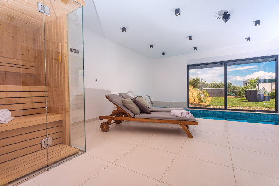 deck chairs for relaxing and a sauna next to it