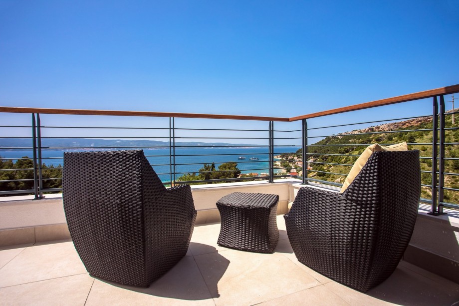 terrace with sea and pool views