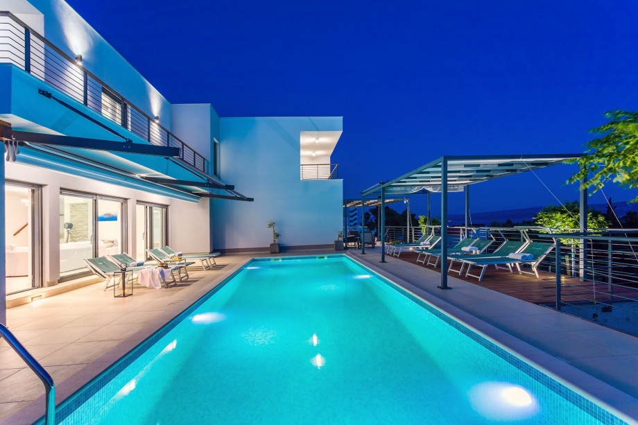 heated 11m x 3,6m private pool, huge sun deck area with 9 modern deck chairs