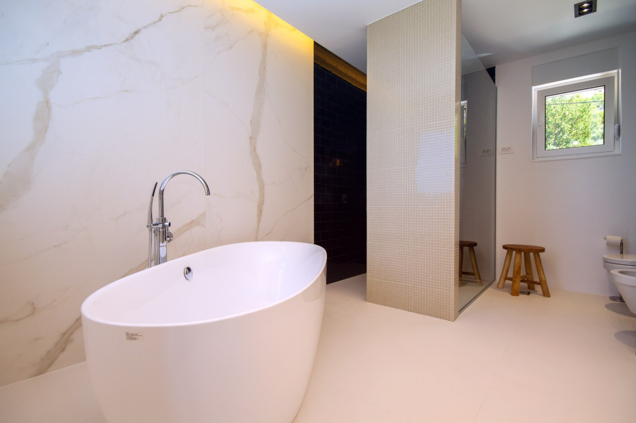 Bathroom in bedroom No.1 with double sink, bath and shower