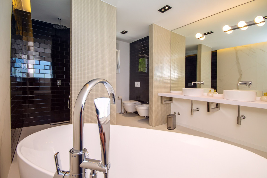 Bathroom in bedroom No.1 with double sink, bath and shower