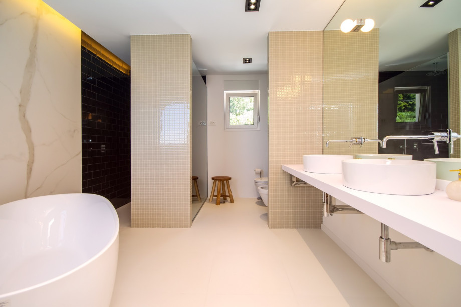 Bathroom in bedroom No.1 with double sink, bath and shower