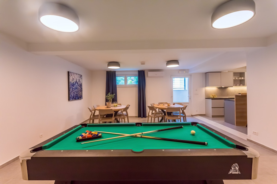 Fun Zone with a Pool table and  Tennis table in a lower ground floor