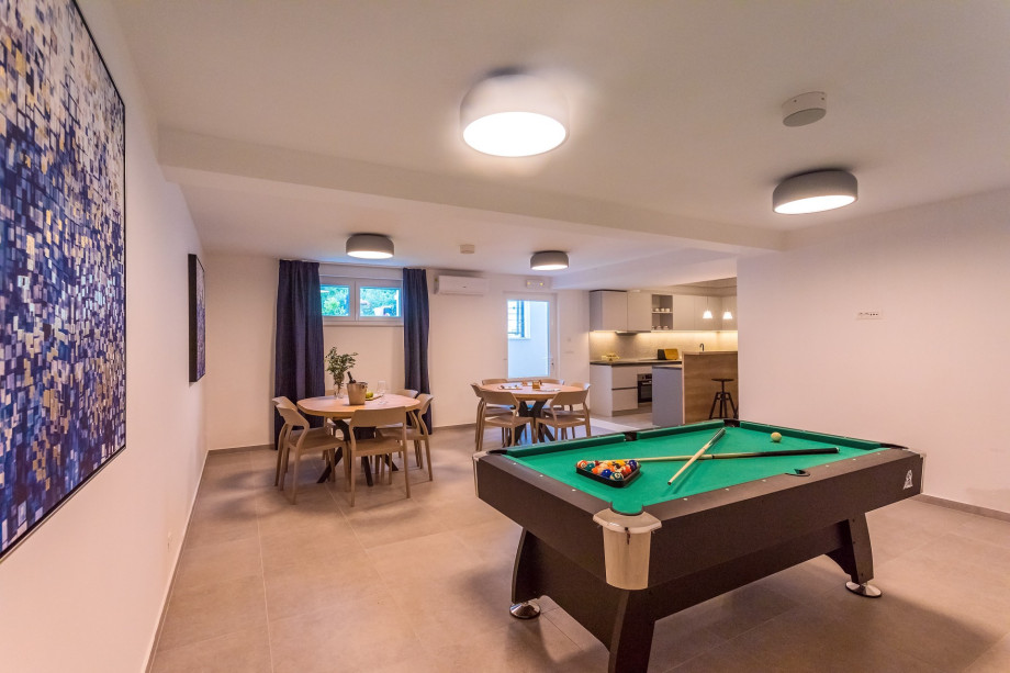The lower ground floor offers a fun zone, kitchen with bar, Media room and Sauna