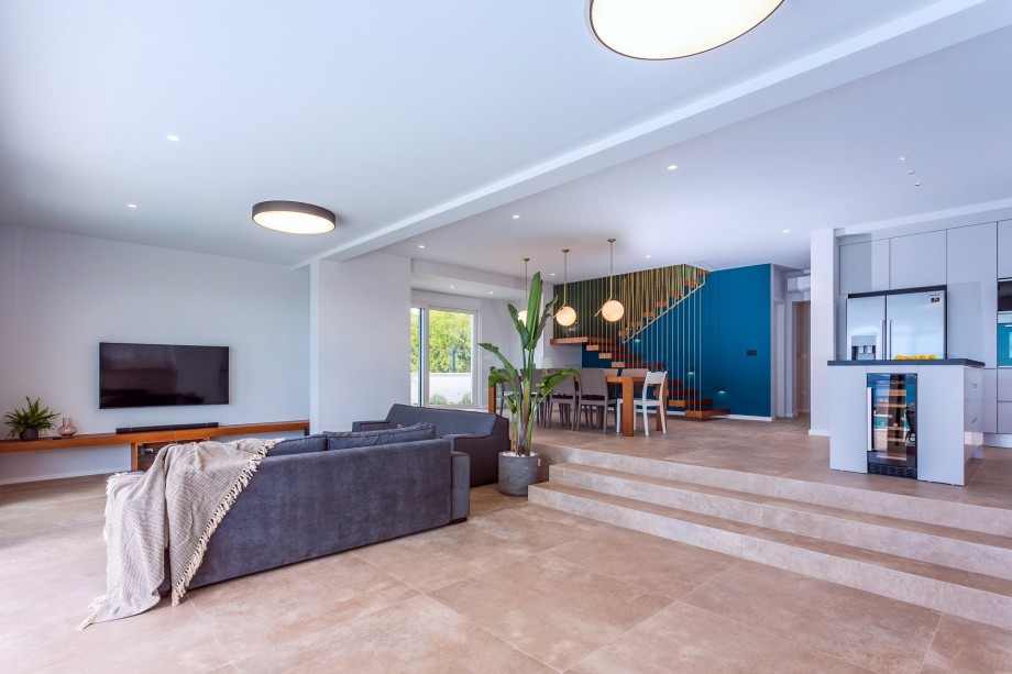 The living area is fully air-conditioned with a sofa (sleep 2), TV, and PS4.