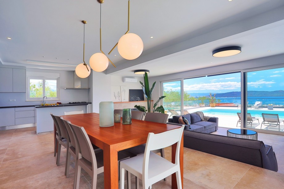 Very modern living area with a wonderful sea view and exit to the pool area