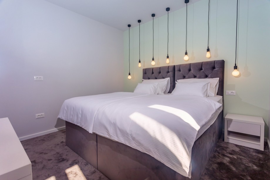 Bedroom No5 with 2 single beds, 90cm x 200cm, a TV,  A/C, en-suite bathroom with a shower