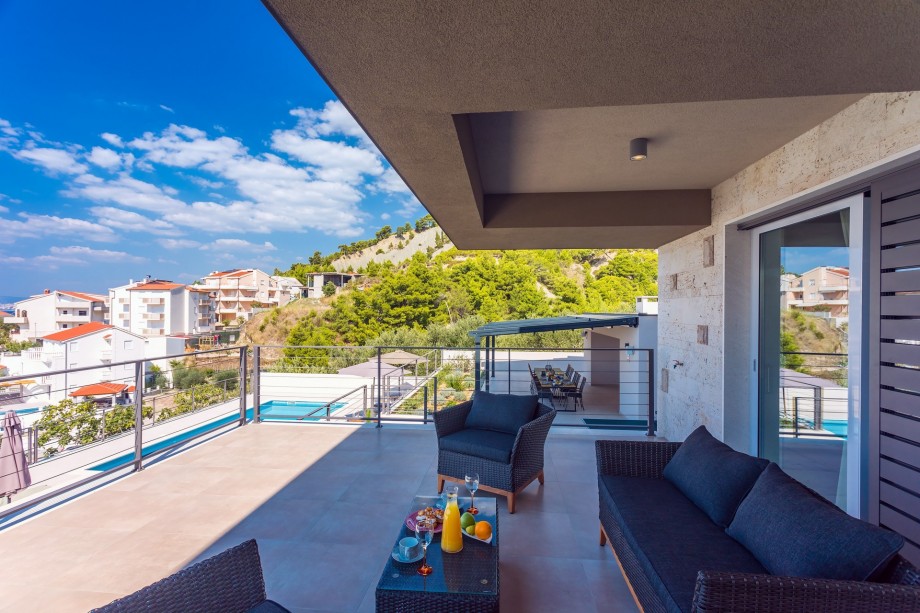 Covered terrace from where few stairs take you to the pool area (ground floor)