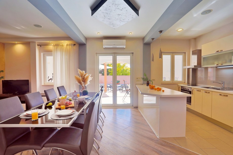 The ground floor offers: a living and dining room with TV, A/C, free WiFi,  play console PS4