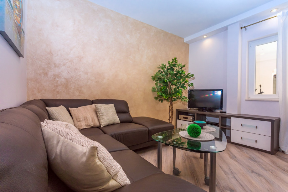 Living and dining room with Living area with  TV, A/C, free WiFi,  play console PS4, fully equipped kitchen and exit to pool area