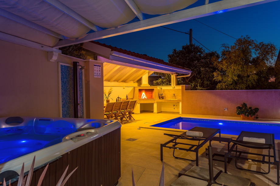 Covered terrace with dining area for 8 pax; another dining area for 8 pax next to the traditional barbecue