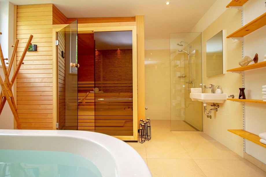 Sauna place with tub and free standing shower - on the ground floor