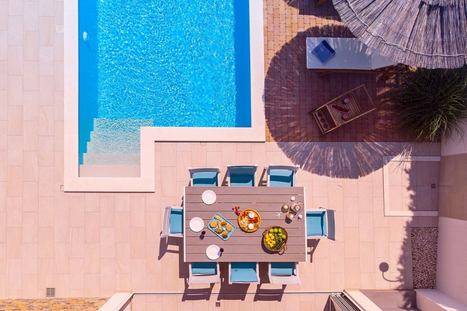 Fully equipped summer kitchen and spacious outdoor pool area