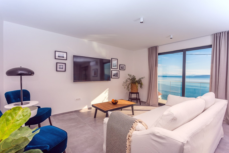 From the dining room, you can approach a lounge area on the west side of the villa