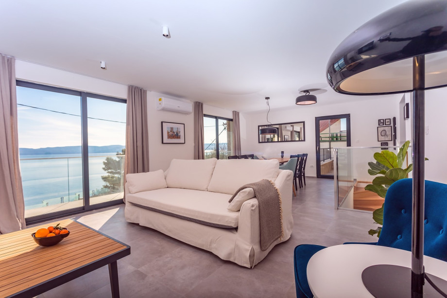 The ground floor level offers a well-equipped kitchen with all the appliances you need for a comfortable stay and  spacious living room