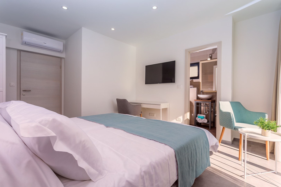 Bedroom No2 with TV, A/C, en-suite bathroom with shower, and a balcony with amazing sea views