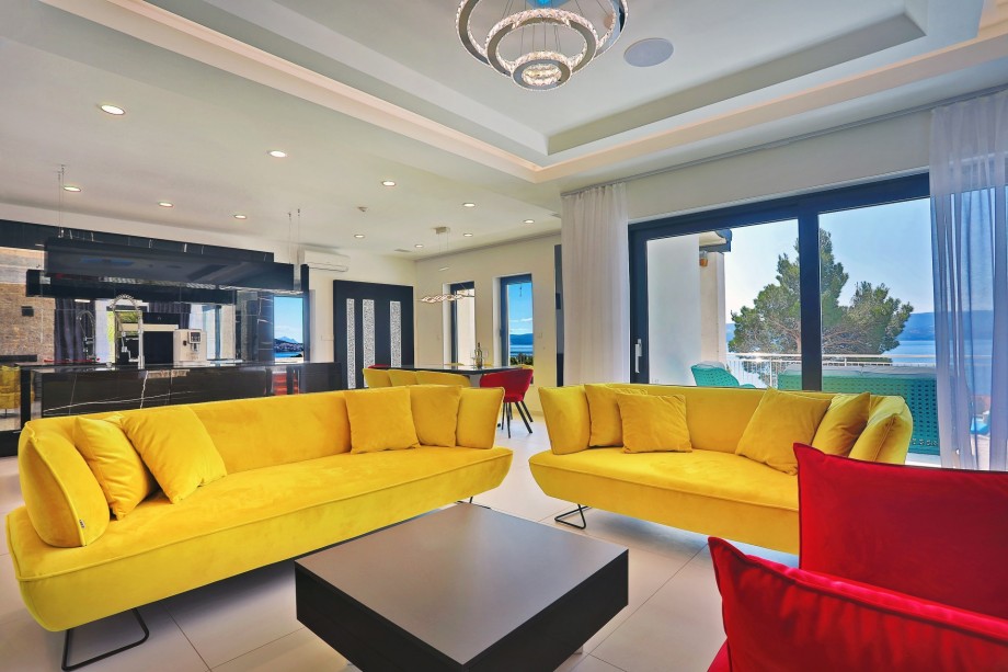 The living room with a direct exit to the pool area