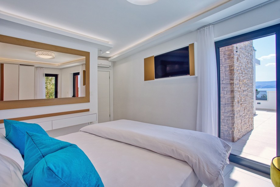 A Bedroom No4 also offers an entrance to the balcony with a sea view