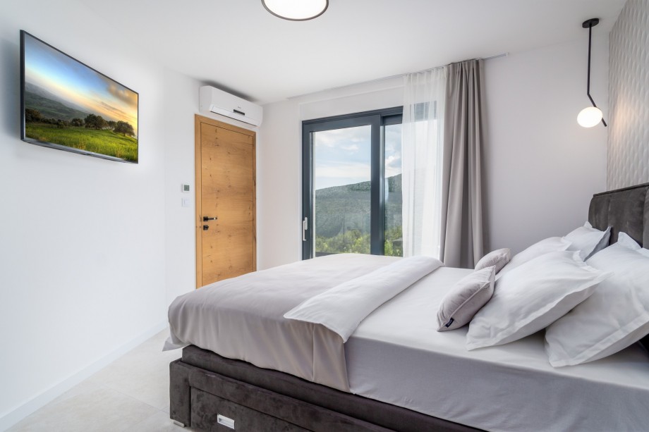 Bedroom No1 also offers a TV, A/C, and an exit to the terrace next to the pool