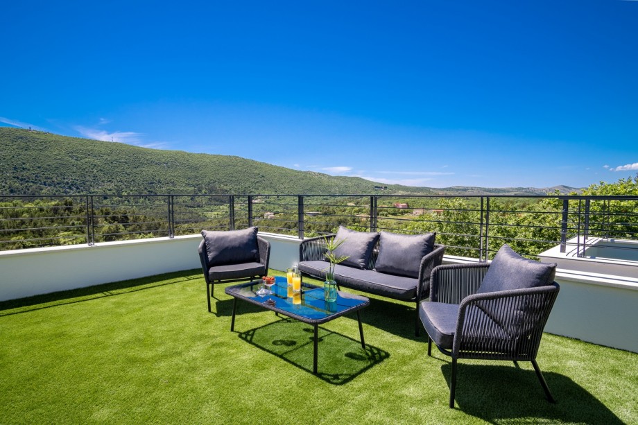 Bedroom No5 offers an exit to the terrace with lounge corner