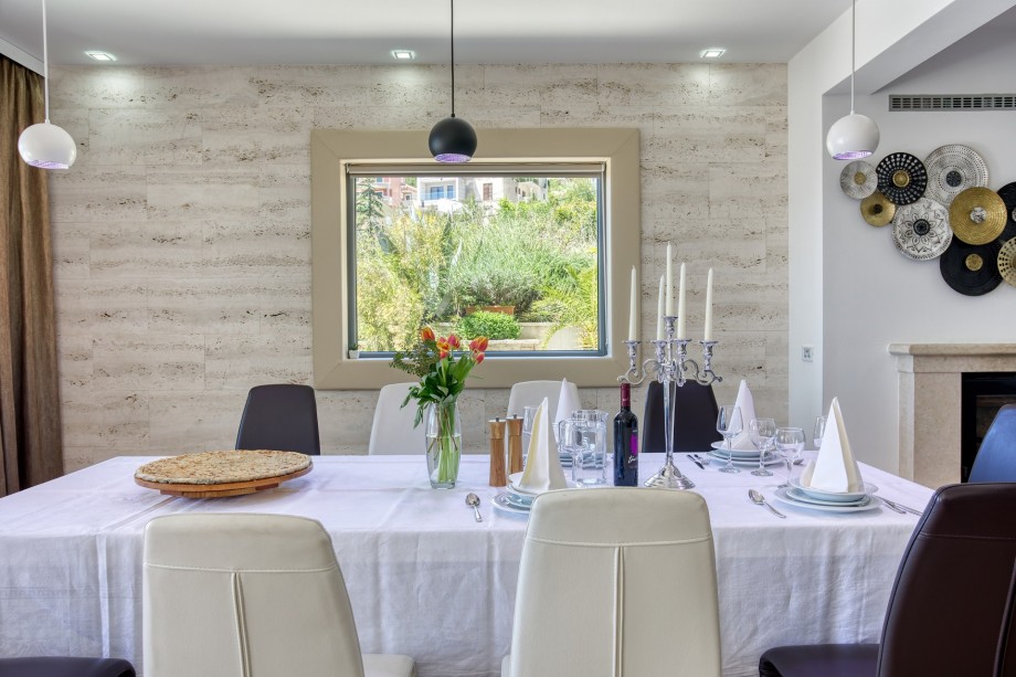 Spacious dining area for 12 with open pool and sea view