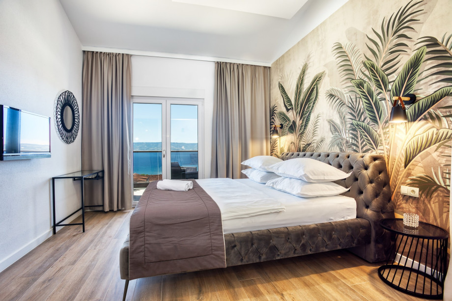 Bedroom No1 with double bed, TV, en-suite bathroom, and terrace