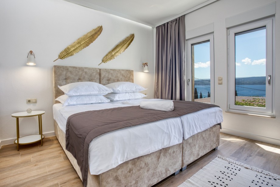 Bedroom No4 with double bed, en-suite bathroom, and terrace