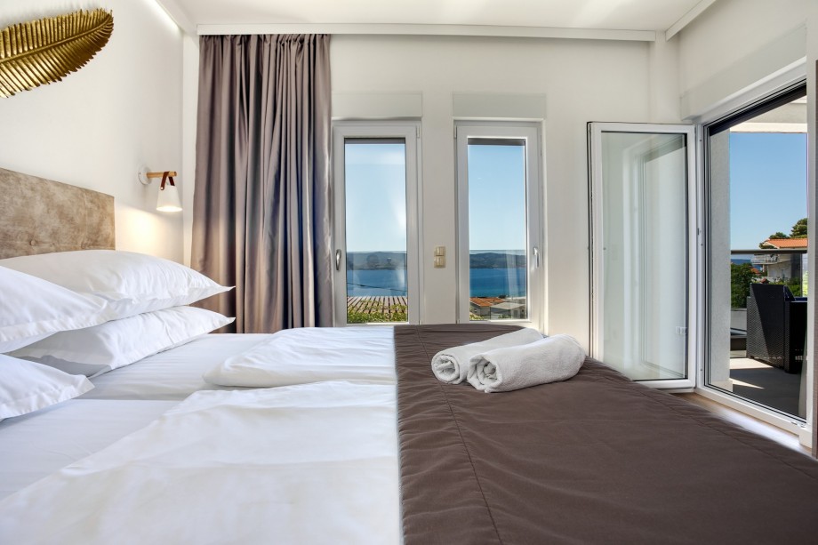 Bedroom No4 with double bed, en-suite bathroom, and terrace