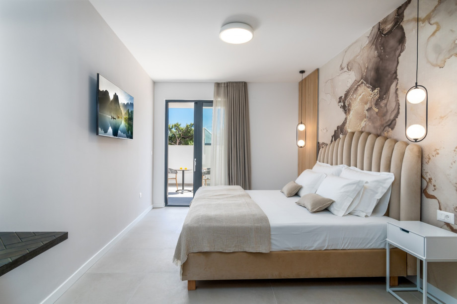 From this level, a few steps down takes you to a bedroom No1 full of light and sun