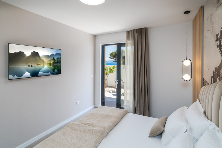 Bedroom No1 offers an en-suite bathroom with shower, A/C, TV, and exit to a terrace