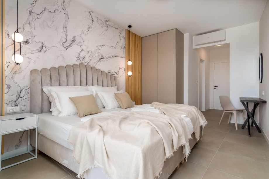 Master bedroom No2 offers an en-suite bathroom with a shower and A/C