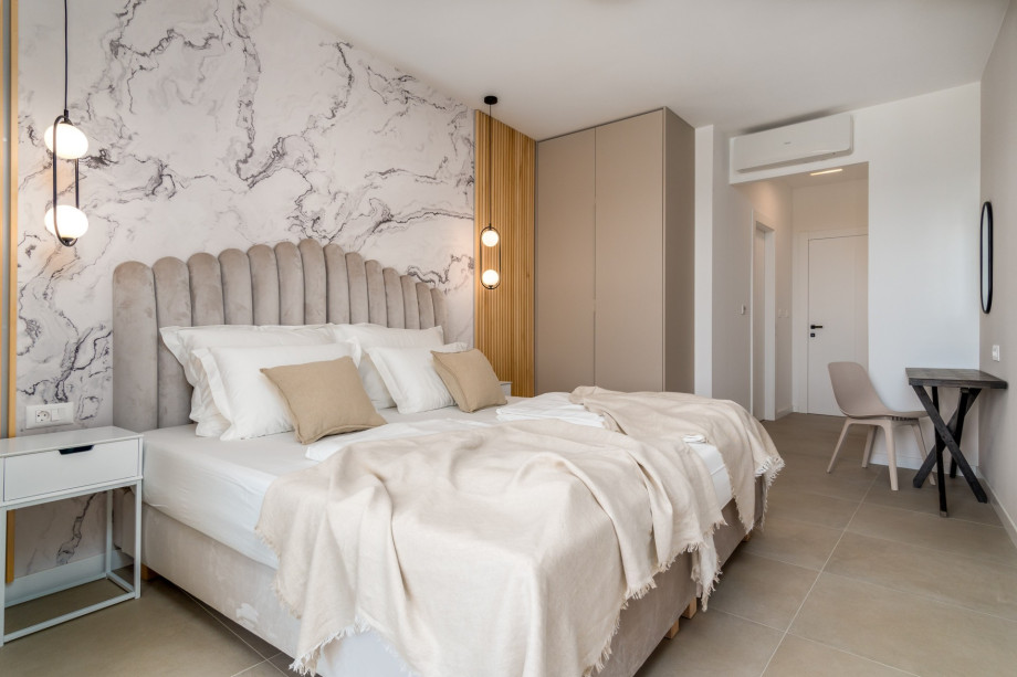 Master bedroom No2 offers an en-suite bathroom with a shower and A/C