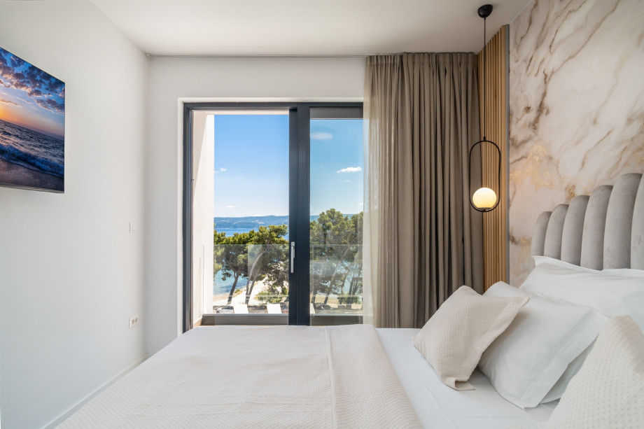 Each bedroom has glass walls and amazing and panoramic sea views