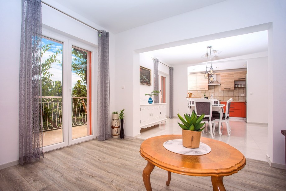 Living and dining area are connected with fully equipped kitchen.