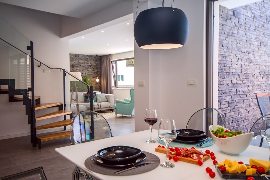 Connected dining and living area and stairs for upper floor