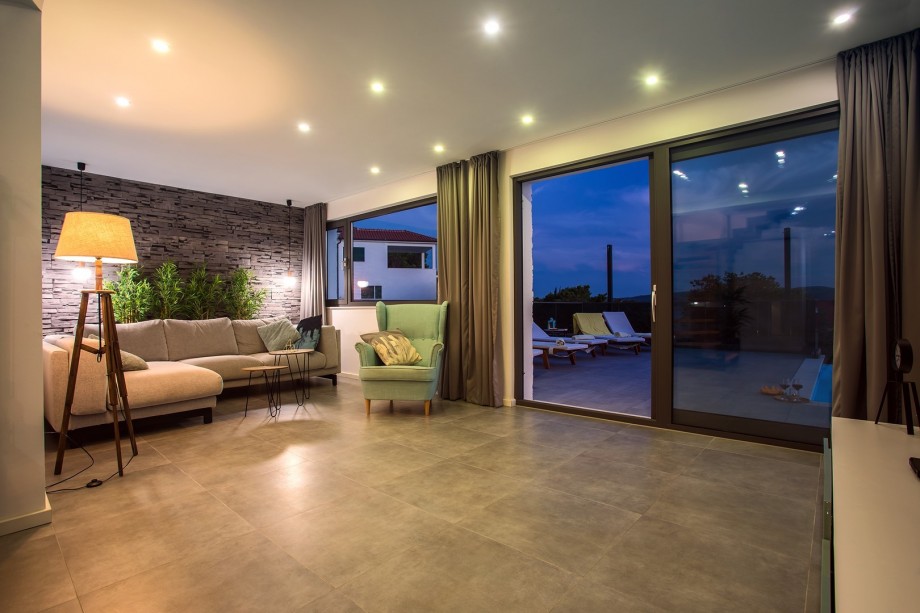 Living area and night view on the pool