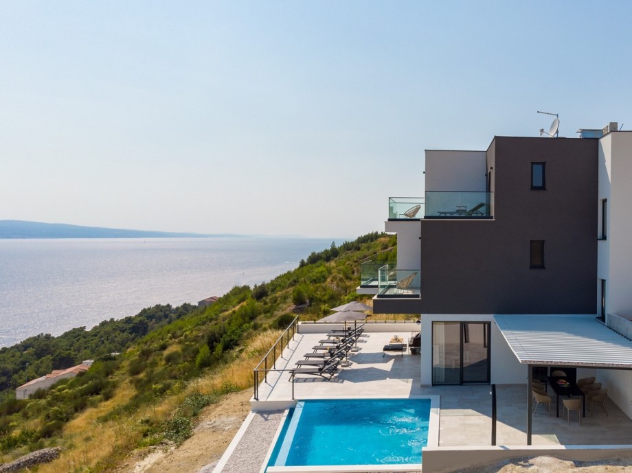 Villa is surrounded with shades of green and blue