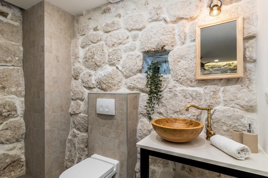 An en- suite bathroom with a shower, a toilet and a sink