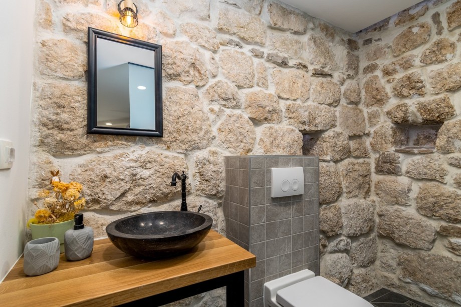 An en- suite bathroom with a shower, a toilet and a sink