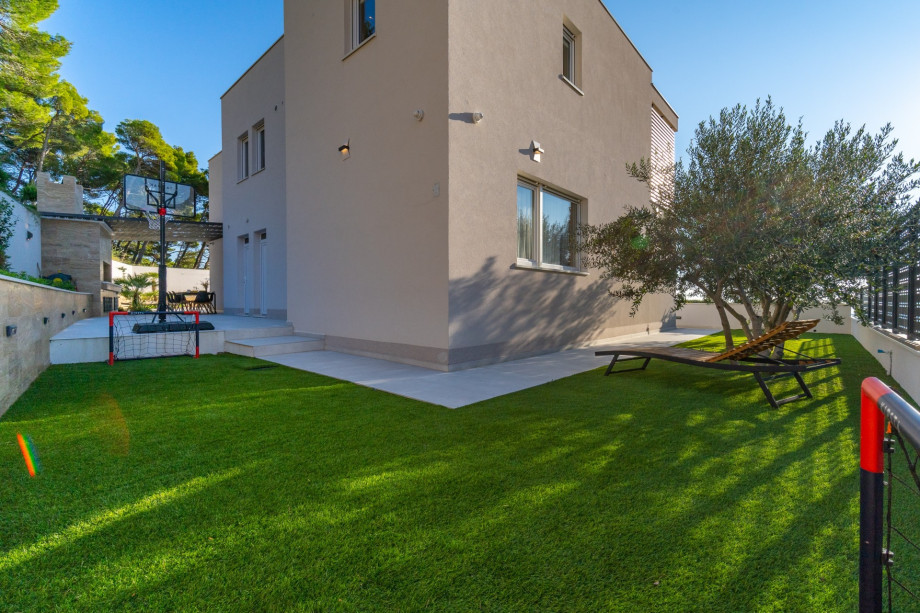 A playground with basketball net and football nets for your youngest family members.