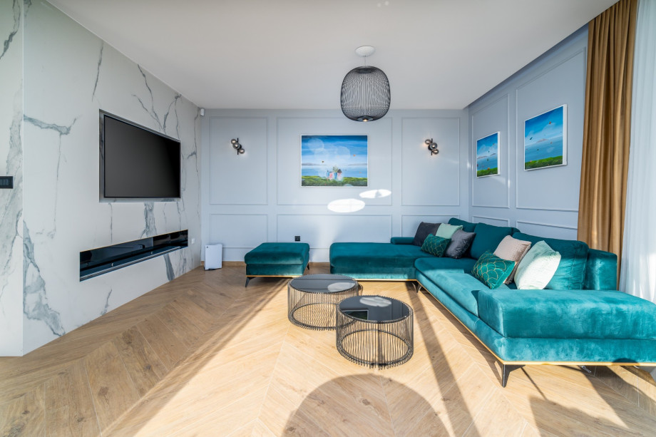 Stylish living room with comfy sofa and TV.