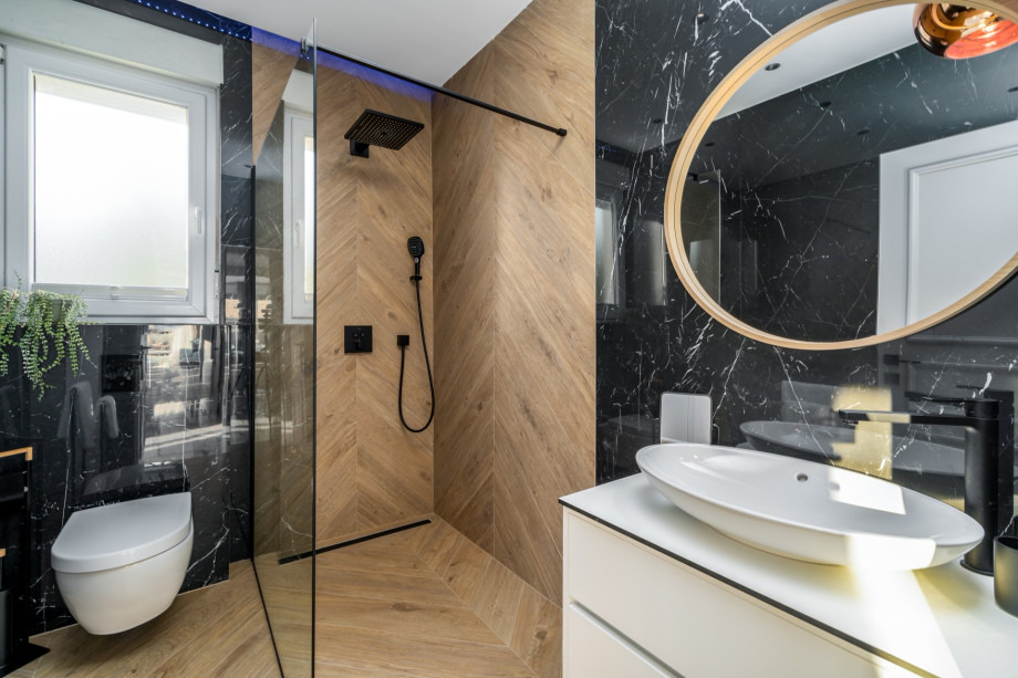 There is a separate family bathroom with a shower, and next door a laundry with washing machine and a dryer.