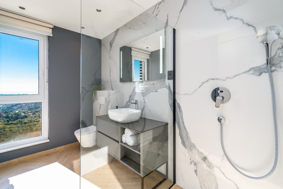 En-suite bathroom with a shower.