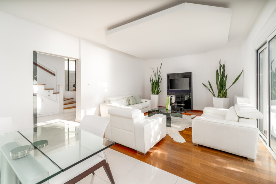 Fully air-conditioned living and dining area that has glass doors on the Southside