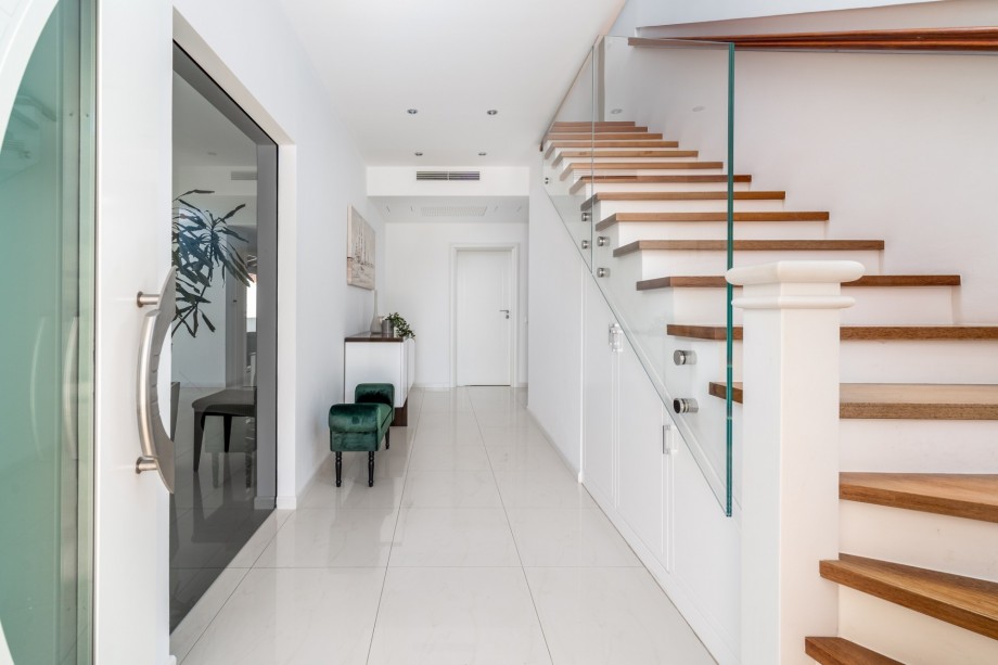 Indoor staircase with a glass wall