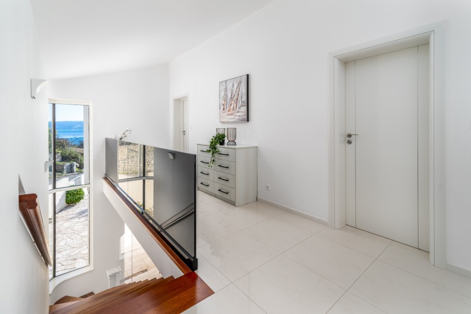 Indoor staircase with a glass wall