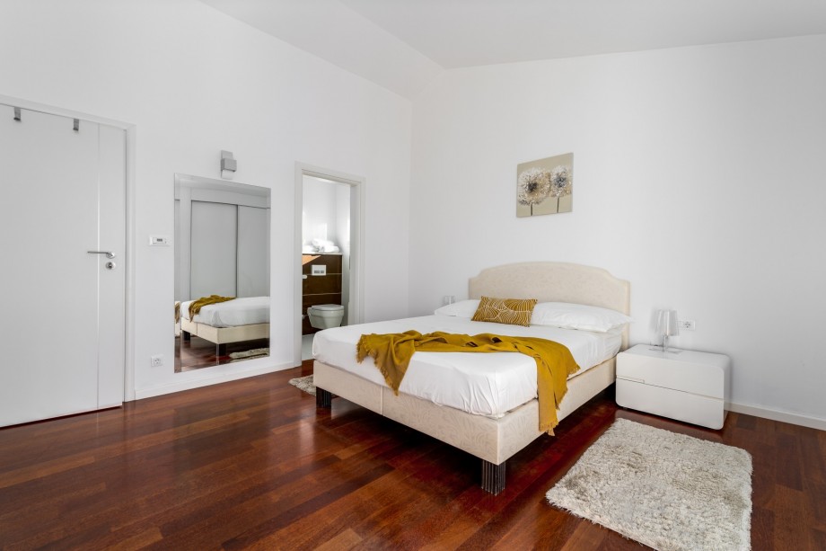 Bedroom No2 with a Queen size bed, AC, en-suite bathroom, a balcony with sea views