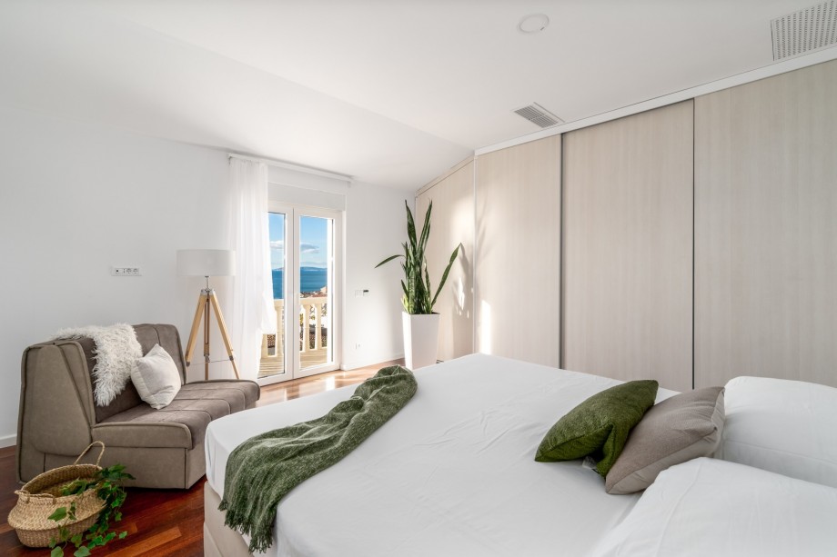 Bedroom No3 with a King size bed, a sofa for 1 person, a balcony with a sea view