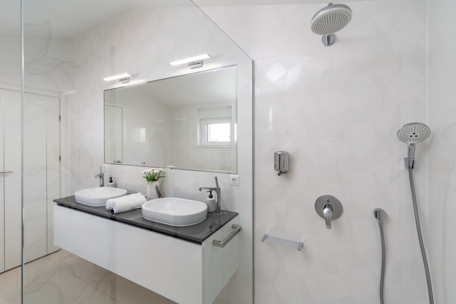 Family bathroom with two sinks and a shower, shared with Bedroom No3 and No4